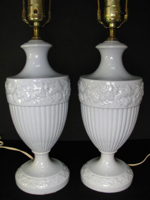 PAIR OF WEDGWOOD STYLE PALE BLUE CERAMIC LAMPS: Pair of Wedgwood style pale blue ceramic lamps with harps and finials. No shades. Minor imperfections to glaze. Base of one lamp has red marks on side of base. Overall condition good. As with a electr