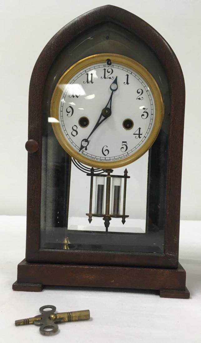 ANTIQUE WATERBURY BEEHIVE MANTEL CLOCK: Antique Waterbury beehive mantel clock measuring 11.1" tall x 6.8" wide. Beveled glass front and back. Original pendulum, includes key. Clock is currently running, minor signs of age to wooden finish,