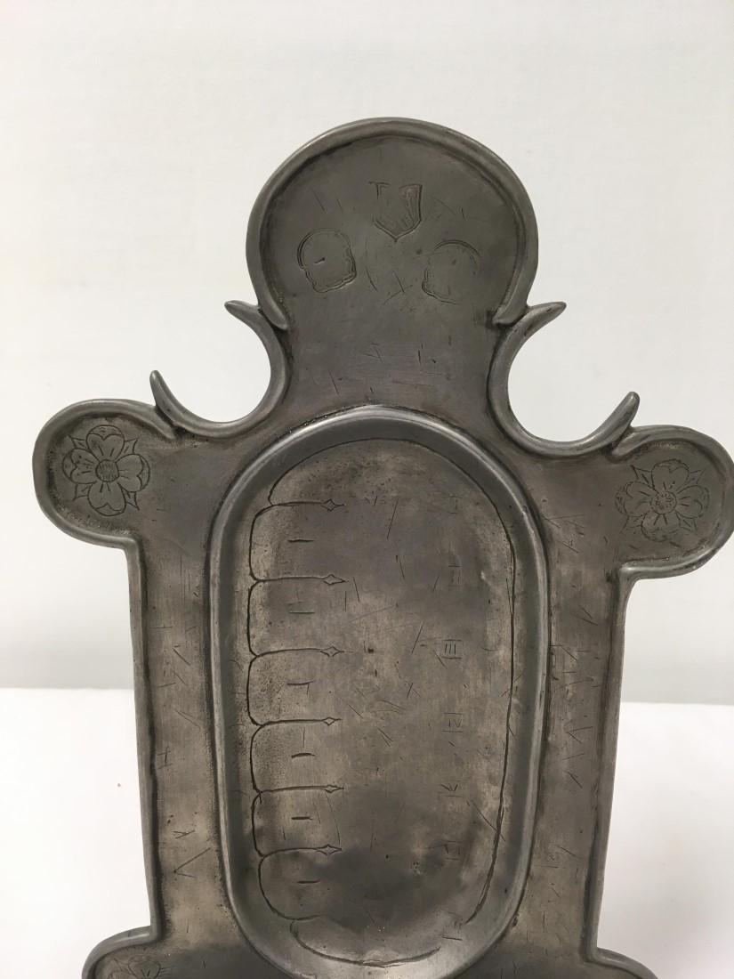 ENGLISH 18TH C BAROQUE ENGRAVED PEWTER WALL SCONCE: An English 18th century Baroque engraved pewter wall sconce. Floral designs with arrows and roman numerals down from I to VII in the center. Three illegible stamped marks near the top. Condition: expe