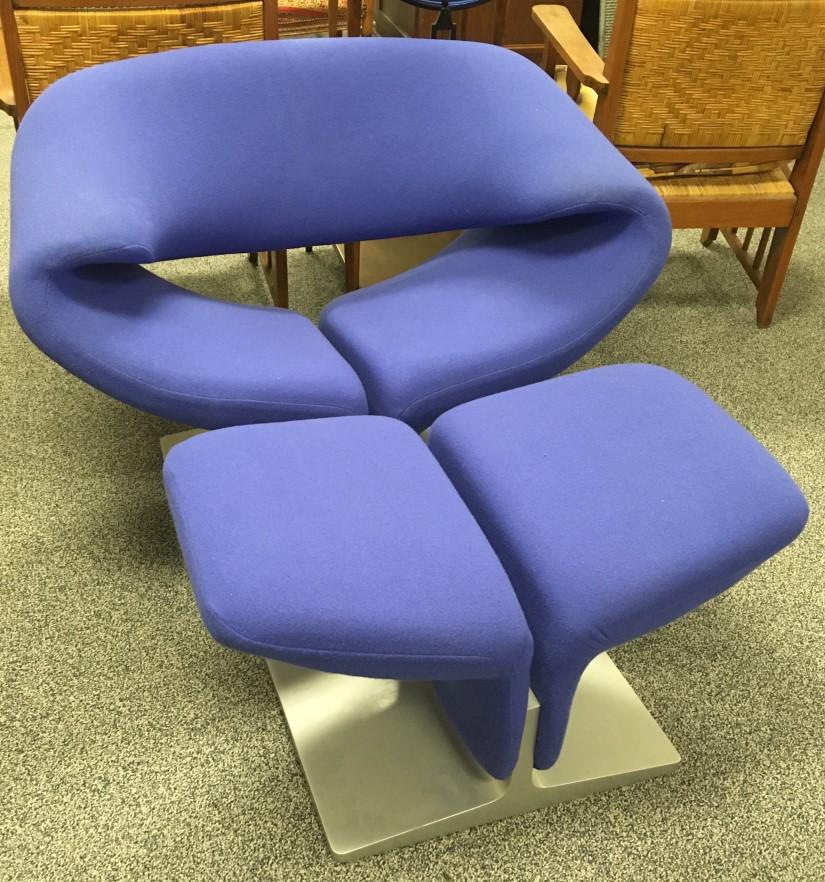 PIERRE PAULIN FOR ARTIFORT RIBBON CHAIR & OTTOMAN: Pierre Paulin for Artifort. Titled "Ribbon Chair", with ottoman. Purple streth fabric upholstery. Both chair and ottoman marked with metal tag on base. Chair measures 28" tall x 41" wide and 31" deep.