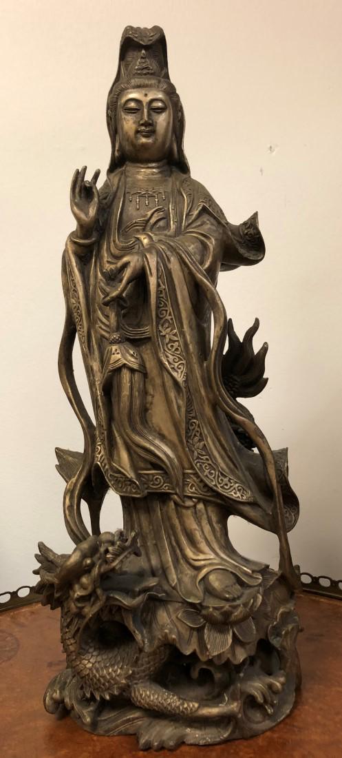 CHINESE CAST WHITE METAL FIGURE OF GUAN YIN: Chinese cast white metal sculpture of Guan Yin, measuring 17.75" tall x 7" wide. Unsigned, unmarked. Condition: signs of age and wear to finish, see images. Weight: 15 lbs.