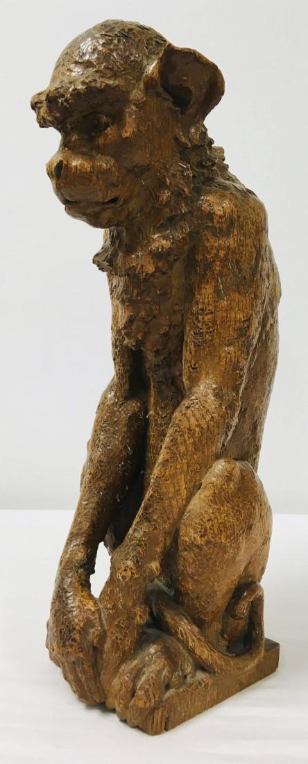 ANTIQUE FIGURAL MONKEY CARVED WOOD NEWELL POST: Antique figural carved wood newell post in the form of a monkey. Measures 18.5" tall. Unsigned, base has a few holes from prior mountings, see images. Condition: expected signs of wear and age to fini
