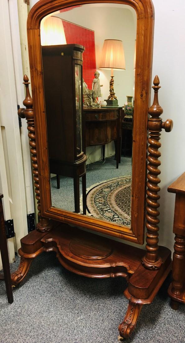 ANTIQUE VICTORIAN CARVED WALNUT CHEVAL MIRROR: Antique Victorian carved walnut cheval mirror on castors. Quality carving, barley twist style side pillars, storage in base. Condition: good, no apparent losses or repairs, see images. Measures 67.5"