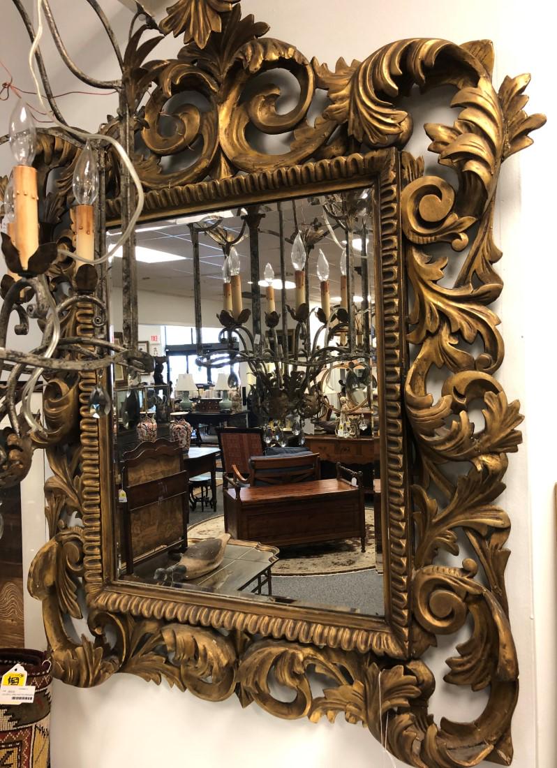 ORNATE ANTIQUE BAROQUE STYLE BEVELED MIRROR: Ornate antique Baroque style beveled glass wall mirror measuring 40" wide x 47.5" tall. Gold tone finish. Condition: scattered minor repairs, wear to finish, see images. Weight: approx. 40 lbs.