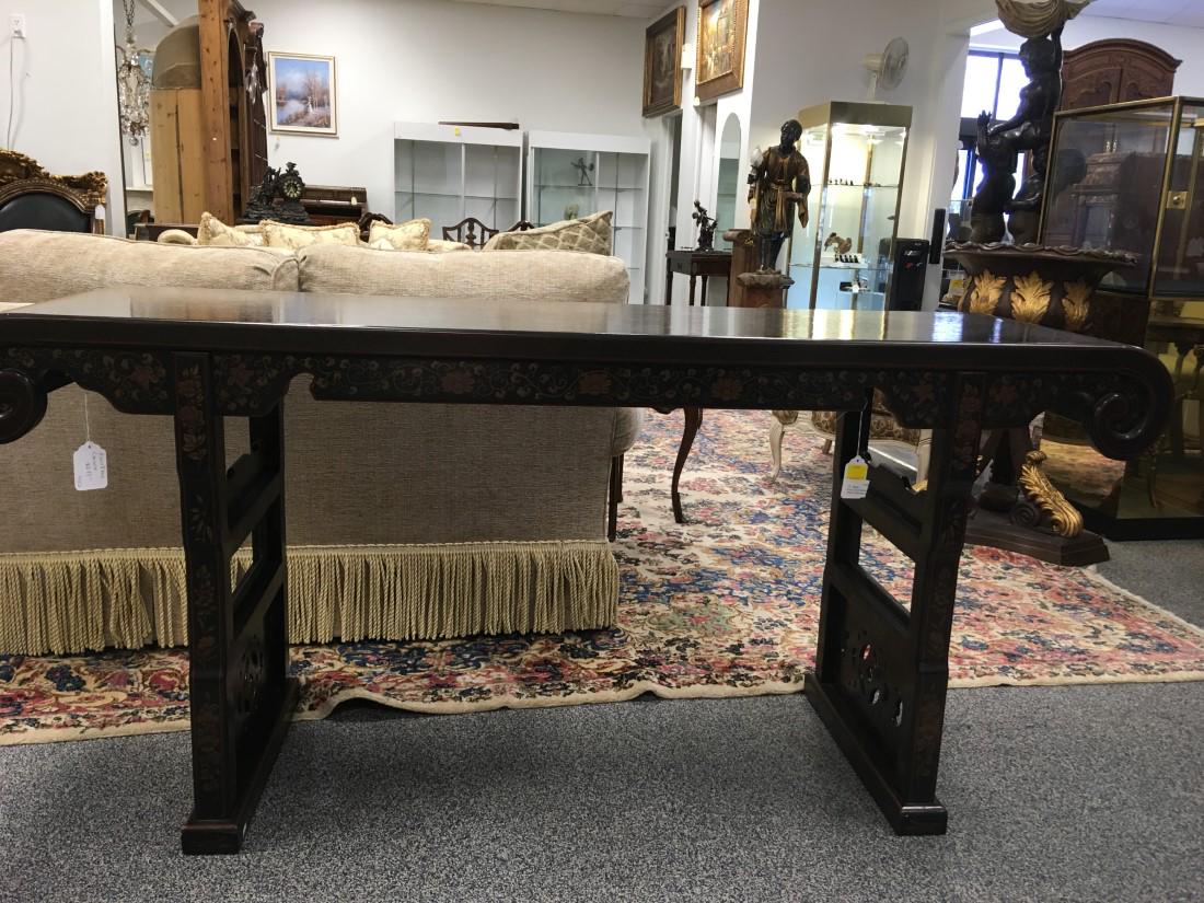 BLACK LACQUER CHINOISERIE ALTAR TABLE OR CONSOLE: A black lacquer and Chinoiserie decorated altar table or console. Measures: 70" long x 20" deep x 33" tall. Condition: good