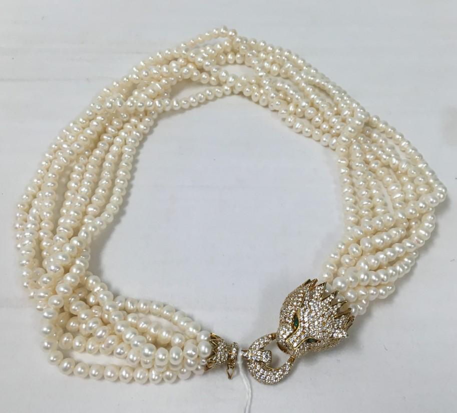 STERLING, FRESHWATER PEARL & CZ PANTHER NECKLACE: Sterling silver, freshwater pearls, and cubic zirconia multi strand necklace. The clasp in the form of a panther head, embellished with cz. Marked "S 925" on each clasp. Condition: good, no signs of d