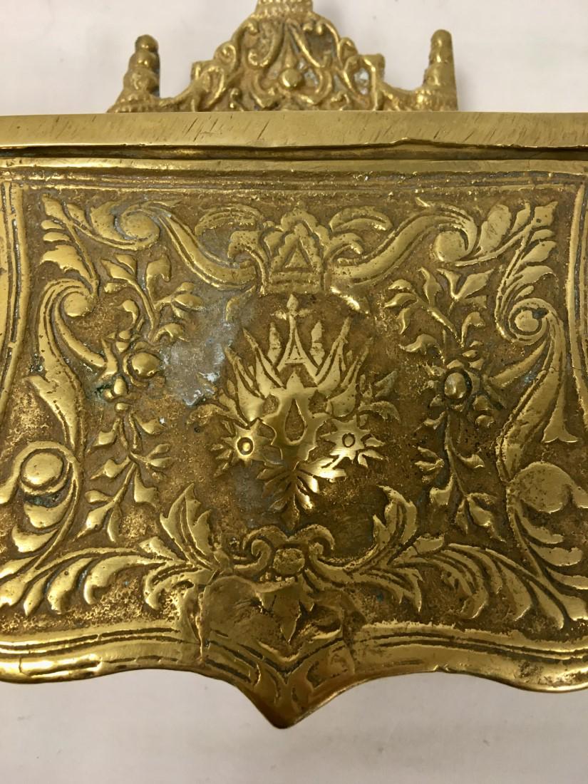 ANTIQUE TURKISH CAST BRASS PALASKA CARTIDGE CASE: Antique Turkish / Ottoman cast brass Palaska or belt worn cartridge case. Hinged lid. Bracket affixed verso for looping on a belt. Measures 4.2" wide x 5.5" tall and 1.5" thick. Condition: expected si