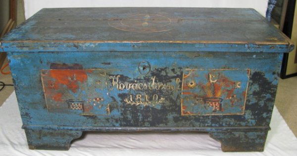 EARLY 19TH CENTURY FOLK ART PAINTED TRUNK: Early Nineteenth century blue painted trunk with folk art designs on the lid and front panel. Old iron strap hinges and lock. The front panel reads Kovacs Yozsef 1810. Measures 21 1/2" high by 46" wid