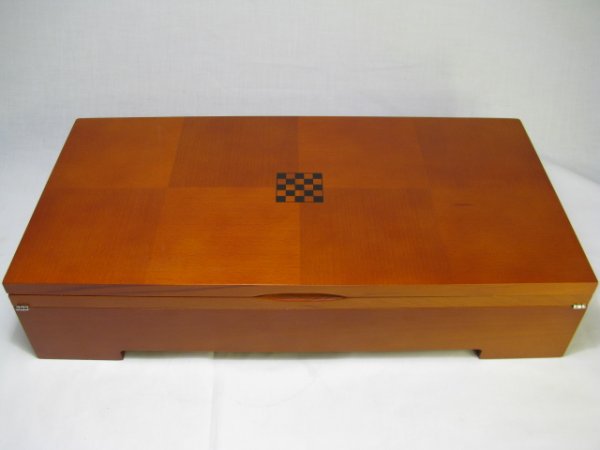 MICHAEL GRAVES CARVED CHESS SET WITH BOARD & BOX: Contemporary carved wood chess and checkers set with board and box by acclaimed architect Michael Graves. Largest chest piece (King) measures 2 3/4" tall, smallest chest piece (pawn) 1" high. Board is