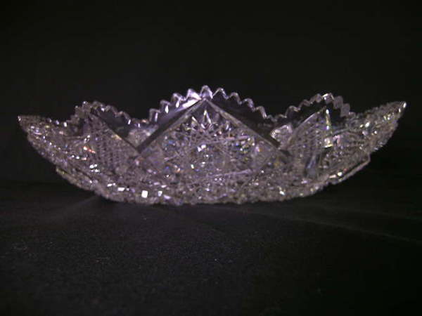 OVAL CUT GLASS CRYSTAL BOWL AMERICAN BRILLIANT: OVAL CUT GLASS CRYSTAL BOWL AMERICAN BRILLIANT - Antique crystal bowl measures 11 3/4" long x 5 1/4" wide x 3" high. Few pen point sized chips to rim.****PLEASE NOTE ***** The Ending Time posted for t