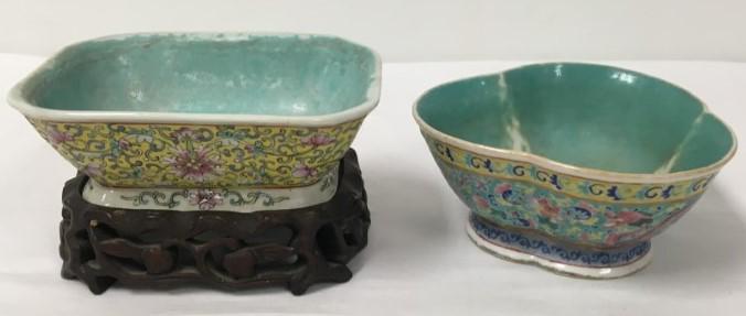 TWO 19TH C CHINESE FOOTED BOWLS, TONGZHI ETC.: Lot of two 19th century Chinese famille rose footed bowls. Straits style. One with carved wooden stand. The trefoil shaped bowl is marked and of the period Tongzhi, while the other is marked Qianlong