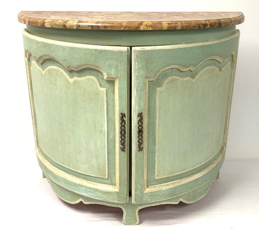 VINTAGE FRENCH PROVINCIAL DEMILUNE CABINET: Vintage French Provincial demilune cabinet with faux marble top and painted finish. Condition: minor signs of wear to finish, lock mechanism has been removed but is included, no key, doors do not stay