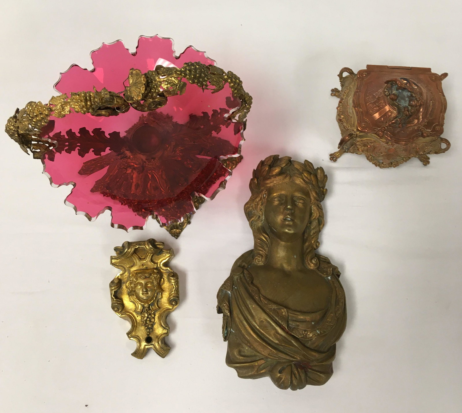 ANTIQUE DECORATIVES: GILT BRONZE, CRANBERRY GLASS: Lot of assorted antique decoratives. Includes a gilt bronze cast bust figure of a woman, a small ormolu mount, an Art Nouveau dresser box, and a gilt metal & cut cranberry glass compote. Condition: mi