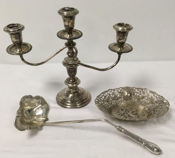 ANTIQUE STERLING & .800 SILVER: GERMAN ETC.: Lot of antique sterling and .800 silver. Includes a weighted sterling three candle candelabrum, a sterling handled ladle, and an antique German pierced .800 silver basket with repousse cherub scene (7