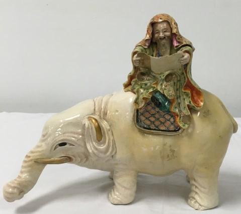JAPANESE MEIJI SATSUMA PORCELAIN ELEPHANT KORO CEN: Japanese Meiji period Satsuma porcelain elephant with rider form incense burner / censer or Koro. Smoke exits the mans mouth when in use. Measures a total of 10" tall x 12.25" long and approx. 6" wide
