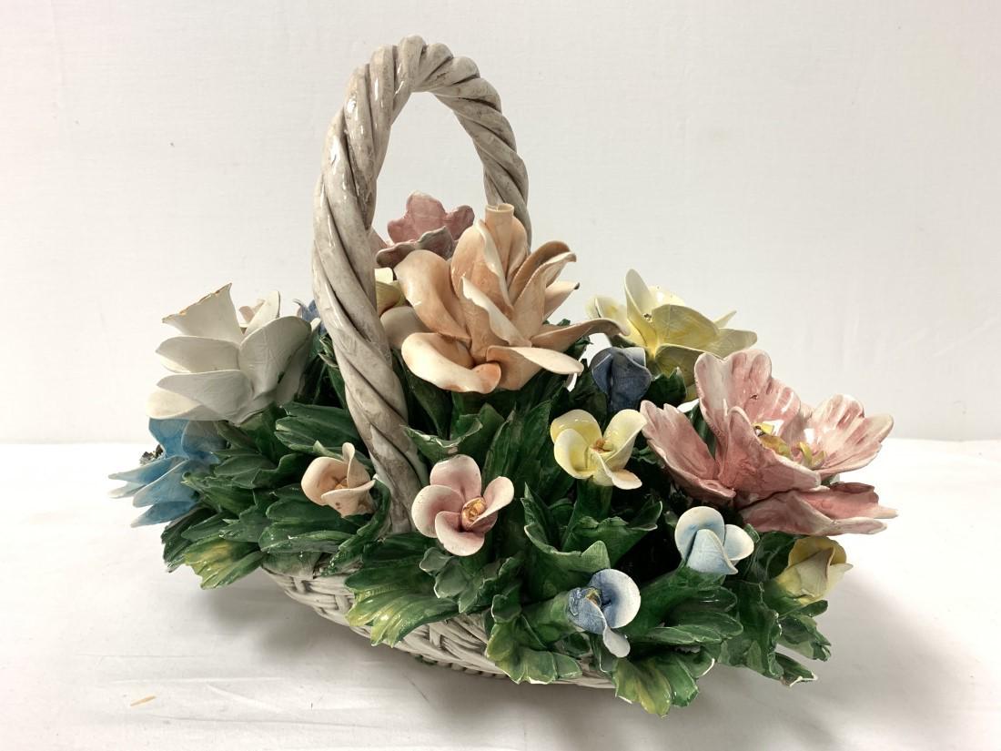VINTAGE ITALIAN CAPODIMONTE FLORAL CERAMIC CENTERP: Vintage Italian Capodimonte floral ceramic centerpiece basket. Measures 12" tall x 15" long and 8.5" wide. Signed on base. Condition: no repairs, scattered minor chips/flakes here and there, some of w