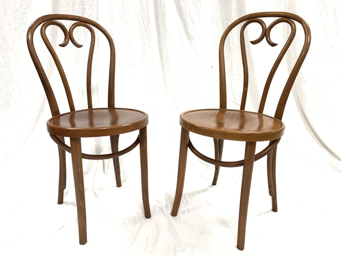 PAIR VINTAGE THONET BENTWOOD SIDE CHAIRS: Pair of vintage Thonet bentwood side chairs, each one marked on base "Made in Romania" with circle mark. Each chair measures 35.25" tall x 16" wide and 20" deep. Condition: no repairs or losses, minor