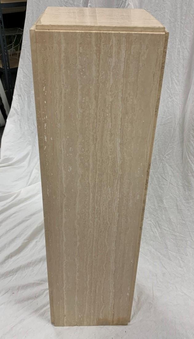 MODERN CUT TRAVERTINE PEDESTAL STAND: Modern cut travertine pedestal stand measuring 38" tall x 10.75" x 10.75". Condition: small chip to base edge, some minor discoloration in areas near base, see images. Weight: approx. 85 lbs.
