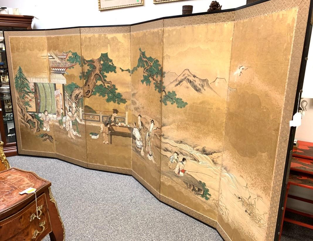 JAPANESE EDO PERIOD KANO SCHOOL PAINTED SCREEN: Japanese Edo period Kano school six-panel painted folding screen. Late 18th century, depiction of three men socializing. The screen measures a total of 68" tall and each panel measures 24.75" wide. Ed