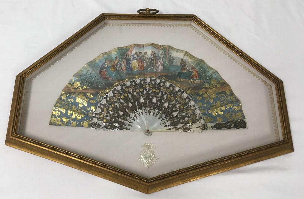ANTIQUE VICTORIAN HAND PAINTED MOP FOLDING FAN: Antique Victorian hand painted mother of pearl folding fan. Framed in shadow box measuring 20.5" tall x 28" wide and 1.5" deep. Condition: minor signs of age and use to frame, very small amount of deb