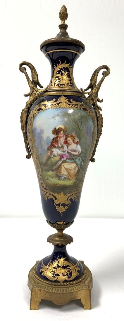 ANTIQUE SEVRES ORMOLU MOUNTED PORCELAIN URN: Antique Sevres French bronze ormolu mounted porcelain urn with an allegorical scene painted on the front and a scenic view on the back. Once was a lamp and has since been converted back to a decorativ