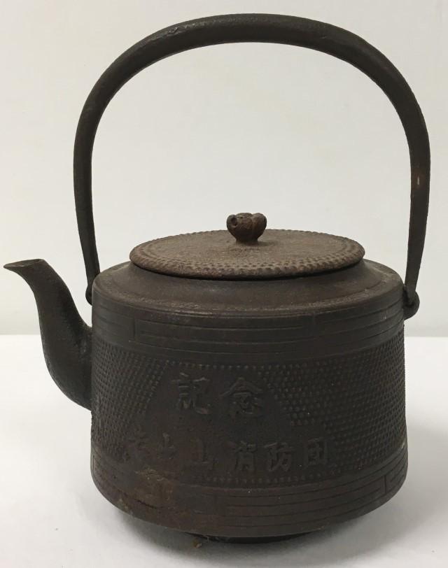 ANTIQUE JAPANESE MEIJI PERIOD TETSUBIN IRON TEAPOT: Antique Japanese Meiji period tetsubin or cast iron teapot. Measures a total of 9.5" tall x 8.5" long. Marked near spout. Condition: heavy signs of age and wear to finish, one small hole on the side, 