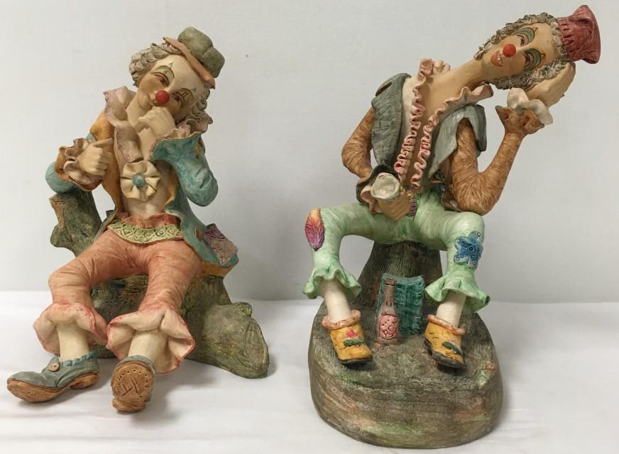 TWO VINTAGE CERAMIC CLOWN SCULPTURES SIGNED GUZMAN: Lot of two vintage ceramic clown sculptures. Each one signed on base "Hecho a Mano, Guzman L, Colombia S.A.". Condition: no damage or repairs to clown with wine bottle and cup, chip to other clown's c