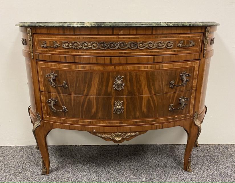 LOUIS XVI STYLE MARBLE TOP DEMILUNE CHEST OF DRAWER: Louis XVI style green marble top demilune chest of drawers. Ormolu style mounts and parquetry inlaid wood. Measures 34.5" tall x 47" wide and 18.75" deep. Condition: scattered small damages to veneer 