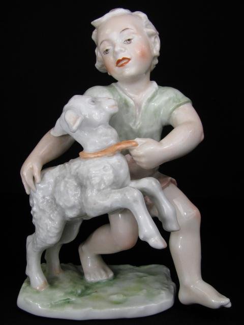ROSENTHAL PORCELAIN FIGURINE BOY WITH LAMB: Rosenthal porcelain hand painted figurine of a boy in shorts with a lamb. Base is marked, Rosenthal, GERMANY, Kunstabteilung, SELB. Measures 6 1/4" tall by 4 1/4" wide by 3 1/2" deep. Condition is goo