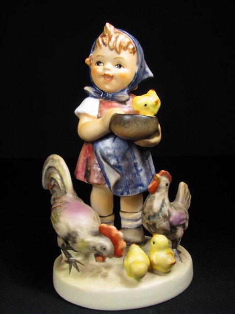 HUMMEL PORCELAIN FIGURINE "FEEDING TIME" TM 4 199/: Hummel porcelain figurine, "Feeding Time," impressed 199/I with trade mark 4 stamped on base. Measures 5 3/4" tall. No chips or cracks. Crazing is on base. See images. Approx. weight 5 ounces.