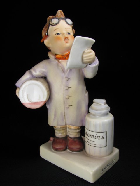 HUMMEL PORCELAIN FIGURINE "LITTLE PHARMACIST" TM 4: Hummel porcelain figurine, "Little Pharmacist," impressed 322 with trade mark 4 stamped on base. Measures 5 3/4" tall. No chips, cracks or crazing. See images. Approx. weight 5 ounces.