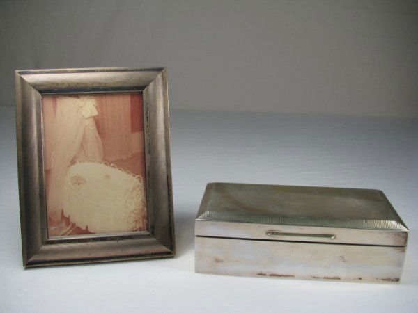 STERLING SILVER PICTURE FRAME & BOX 2 PCS: Sterling silver picture frame with textured surface, wood back panel with an easel. Fits a 3" by 5" photo. Stamped Sterling on the side panel. Second piece is a sterling wood lined trinket box with a