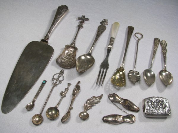 STERLING SILVER SOUVENIR SPOONS PILL BOX & JEWELRY: Small group of sterling silver souvenir spoons, serving pieces, pill box etc. Each piece is marked sterling or has a hallmark. Largest piece is a hollow handle cake server 9 1/2" long by 2" wide with 