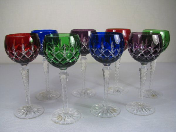 EIGHT CUT to CLEAR CRYSTAL RHINE WINE STEM GLASSES: Eight multi color cut to clear crystal Rhine wine stem glasses made in Hungry by Ajka. Two cobalt, two ruby, two emerald and two amethyst. Several with original labels, "Hand Made In Hungry, 1878, Ajk