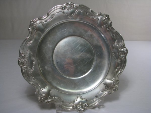 GORHAM STERLING SILVER SERVING TRAY: Gorham sterling silver round serving tray with scroll leaf rim edge. Stamped on the base: Gorham, three hallmarks (lion, anchor, G), Sterling, 745 , shield with a 6 inside it. Weighs 14 troy ounces. M