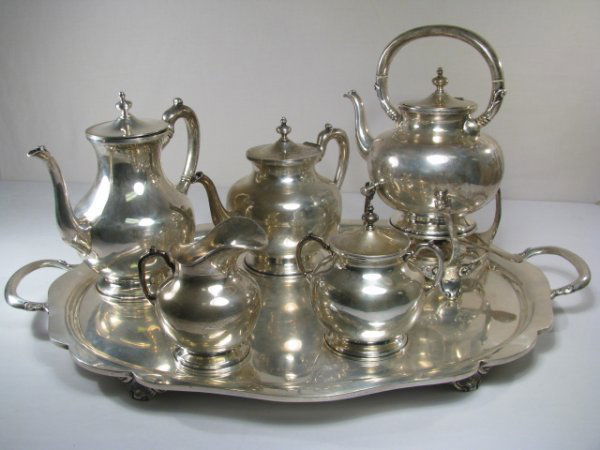 MEXICAN STERLING SILVER COFFEE & TEA SET 7 PCS: Seven piece Mexican sterling silver coffee and tea set. Set consists of: one coffee pot 9 1/4" tall by 9" wide, spout to handle, (hinges on the lid are broken and finial is bent). One teapot 7 1/2" ta