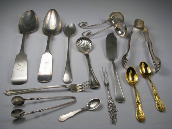 ASSORTED GROUP STERLING & COIN SILVER 14pcs: Group of assorted sterling silver and coin serving pieces. Group consists of: two coin serving spoons with 9" long. One large tong , 6 1/3" long. One master butter knife 7" long. Two small ladles with