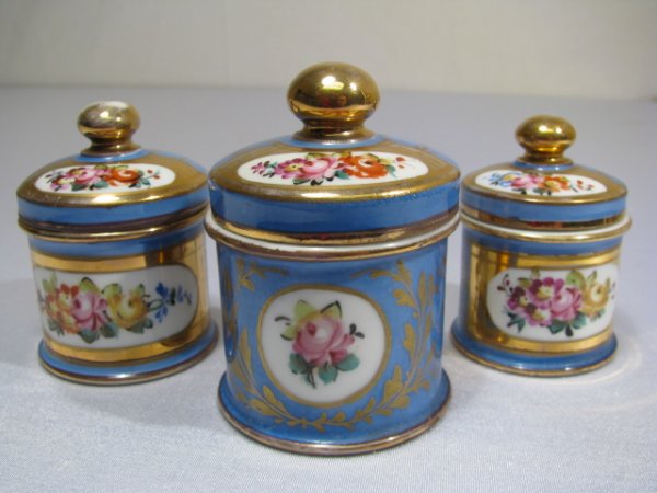 THREE SEVRES PORCELAIN VANITY JARS: Three late 19th/ early 20th century round porcelain vanity jars measuring 2 - 3" tall. All in good condition with normal wear. Shipping weight approximately 8 oz.