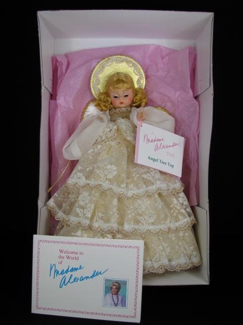 MADAME ALEXANDER DOLL: "TREE TOP ANGEL" 852: Madame Alexander doll "Tree Top Angel" #852 eyes shut with original box and Official Collector Registration card 156660 KM. Angel measures 12 1/4" tall. Box measures 4 3/4" tall by 14" wide by 9 1/4" 