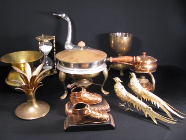 ESTATE LOT COPPER BRASS & CHROME DECORATIVE ITEMS: Large box lot of decorative copper, brass and chrome pieces. Lot consists of: copper and brass chafing dish, brass pineapple, glass hour glass with brass, brass spittoon. two brass pheasants, pair of 