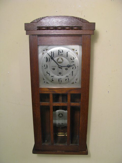 GERMAN OAK CABINET BEVELED WINDOW WALL CLOCK