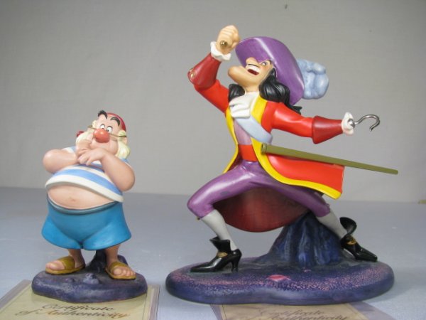 WDCC CAPTAIN HOOK AND MR. SMEE FROM PETER PAN 2 PCS: Two Walt Disney Classics Collection porcelain figures. Mr. Smee measures 5" and boxed is 7" tall x 5 3/4" wide. Captain Hook is 7 1/2" tall and boxed is 9 1/2" square. Total shipping weight is 2 lbs 8