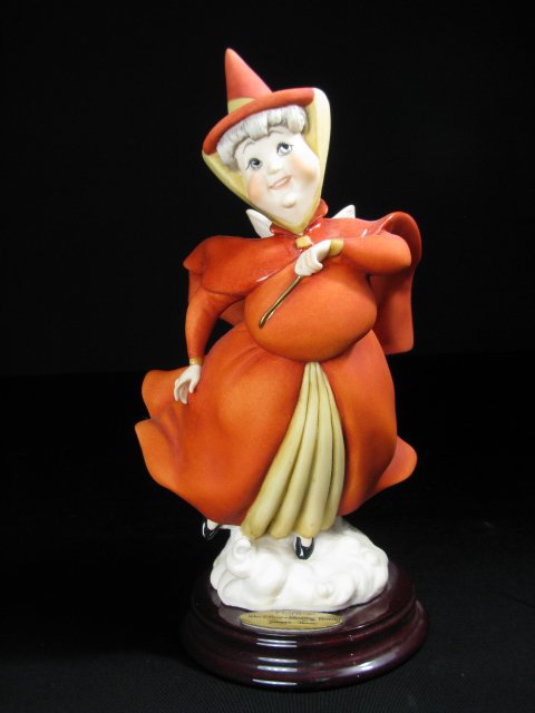 AUTHENTIC GIUSEPPE ARMANI ART DISNEY MERRYWEATHER: Giuseppe Armani porcelain figure measures 8" tall x 4 1/2" wide. Boxed measures 6 1/2" high x 10 1/4" long x 6 1/4" deep. Total boxed weight is 1 lb 4 oz.