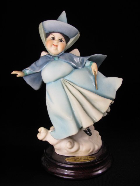 AUTHENTIC GIUSEPPE ARMANI ART DISNEY FLORA FIGURE: Giuseppe Armani figure measures 8" tall x 4 1/2" wide. Boxed measures 6 1/2" high x 10 1/4" long x 6 1/4" deep. Total boxed weight is 1 lb 4 oz.