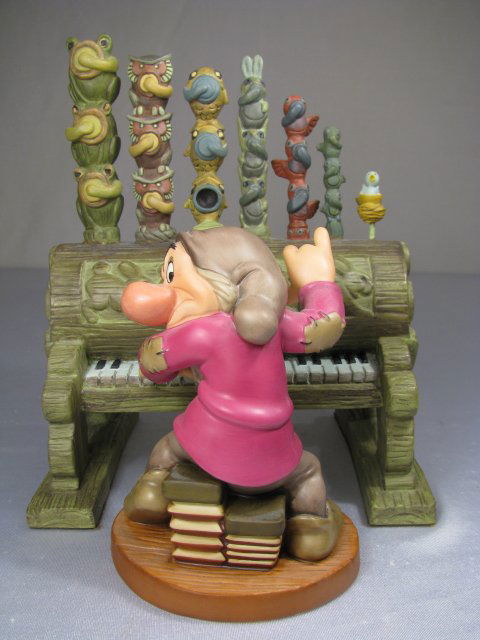 WDCC SNOW WHITES GRUMPY AND PIPE ORGAN FIGURE: Walt Disney Classics Collection porcelain figure measures 5" tall x 4" wide, pipe organ is 7 1/2" tall x 6 1/2" wide. Boxed is 15 1/2" tall x 11 1/2" wide. Weighs 4 lbs.