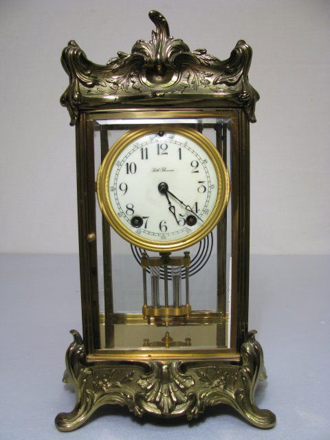 SETH THOMAS CRYSTAL REGULATOR: Enameled face with some damage above 12 o'clock. Time and strike mechanism. Mercury style pendulum. Measures 14 1/4" tall x 7" wide x 7" deep.