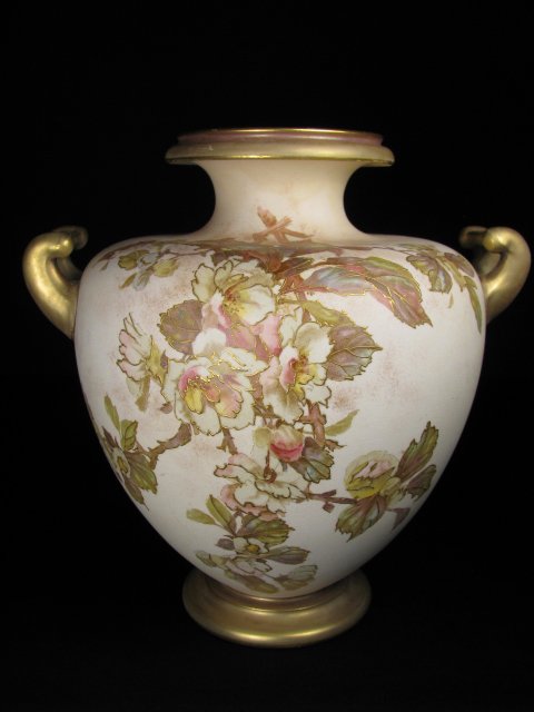 DOULTON BURSLEM GILT TRIMMED PORCELAIN VASE: Doulton Burl em floral decorated two handle vase with gilt trim. No chips or cracks. Mark on bottom. Measures 8" tall x 8" wide. Weighs 2 lbs 4 oz.
