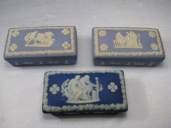 WEDGWOOD BLUE JASPERWARE COVERED BOXES 3 PCS: Three Wedgwood jasperware boxes. Two light blue boxes and one dark blue. All measuring 1" tall x 3 3/4" long x 2" wide. All marked Wedgwood made in England on bottoms. Total weight is 12 oz.