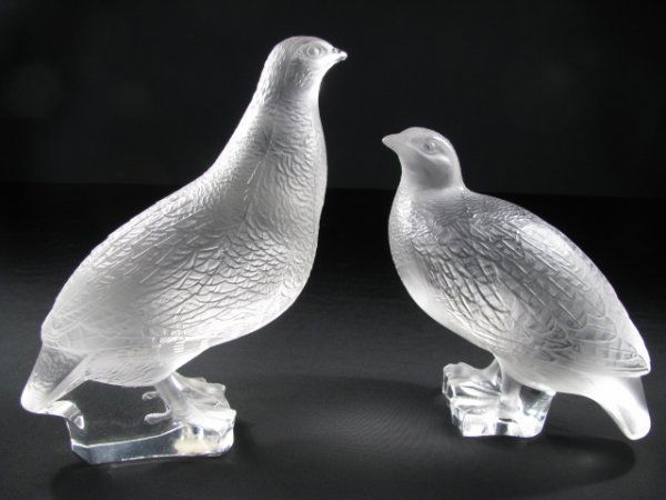 LALIQUE CRYSTAL LARGE BIRD DOVE FIGURES 2 PC: Each signed Lalique, France. Standing bird measures 6 1/2" tall x 6" wide and has tiny flake on beak. Squatting bird measures 5 1/2" tall x 6" long. Total weight is 5 lb 6 oz.