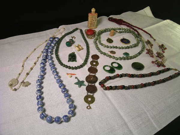 ANTIQUE & VINTAGE ASIAN JEWELRY JADE CINNABAR ETC: ANTIQUE & VINTAGE ASIAN JEWELRY JADE CINNABAR ETC - Nice mixed lot which includes two spinach jade bead necklaces, unusual cloisonne, seed pearl and garnet necklace (needs help) a coin bracelet, rings